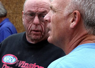 Charlie Utermohle consulting with fellow volunteer