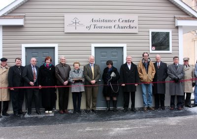 Charlie Utermohle with other board members, staff, and volunteers at the ribbon cutting for the ACTC building